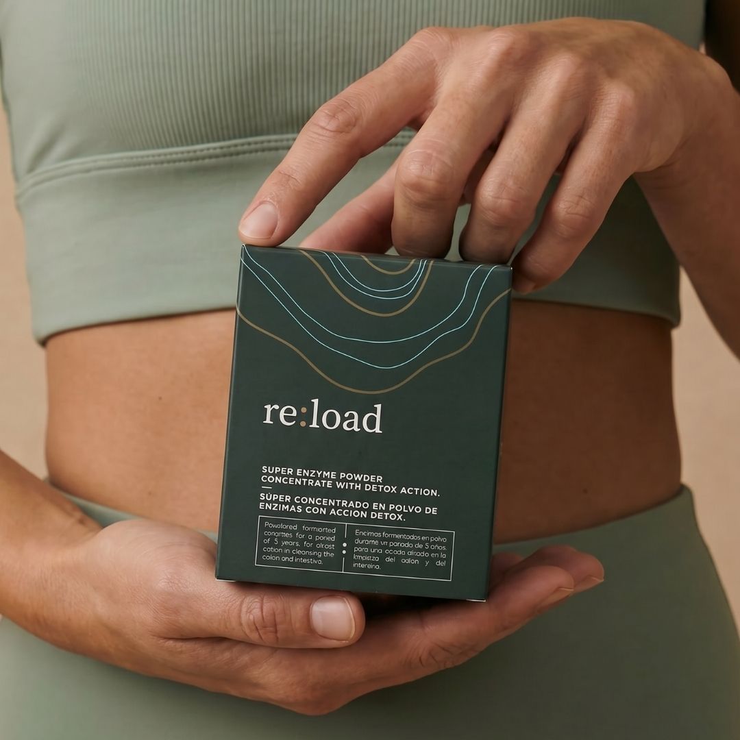 Two hands holding the re:load box in warm daylight