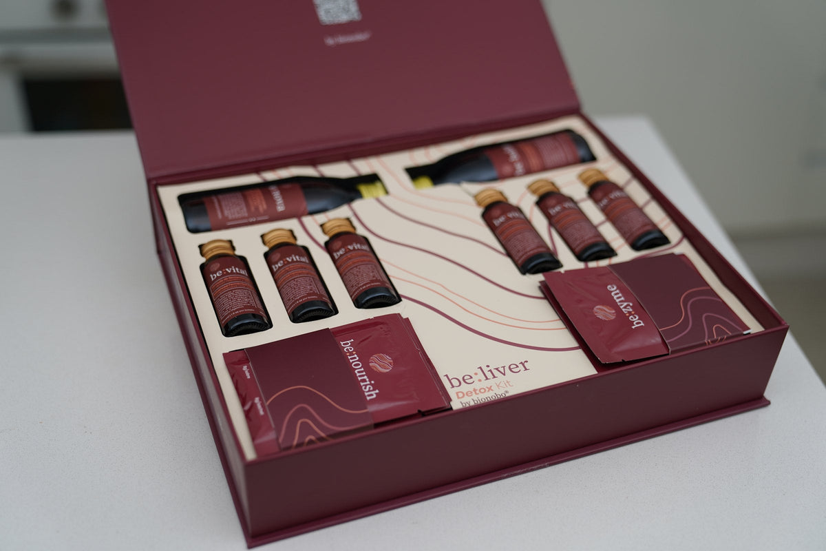 The be:liver kit open, showing the be:vital bottles and be:zyme sachets in the tray