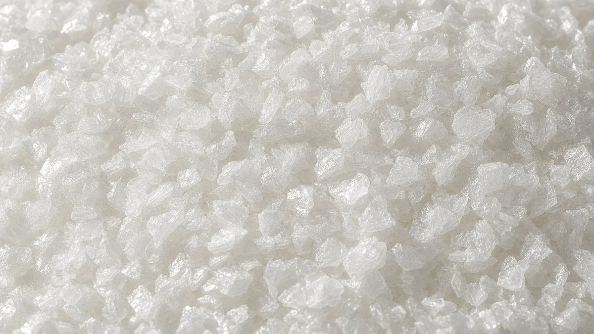 L-taurine, coarse white platy crystals like small flakes of glass