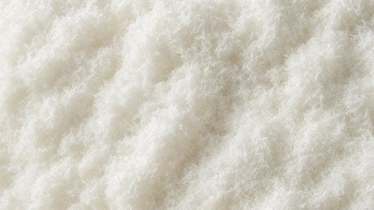 L-tyrosine, a white fibrous crystalline powder of fine short needles